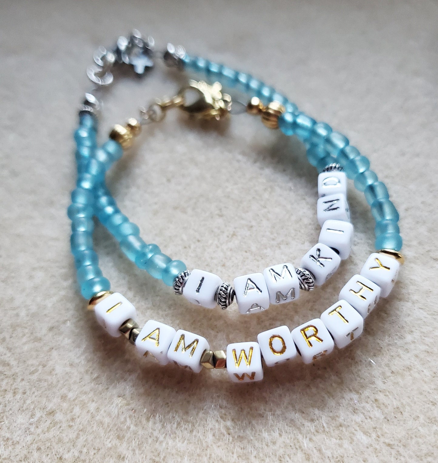 Aqua and silver single strand stackable Word bracelet