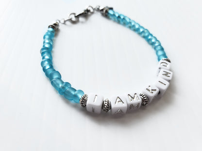 Aqua and silver single strand stackable Word bracelet