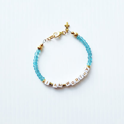 Aqua and gold single strand stackable Word bracelet
